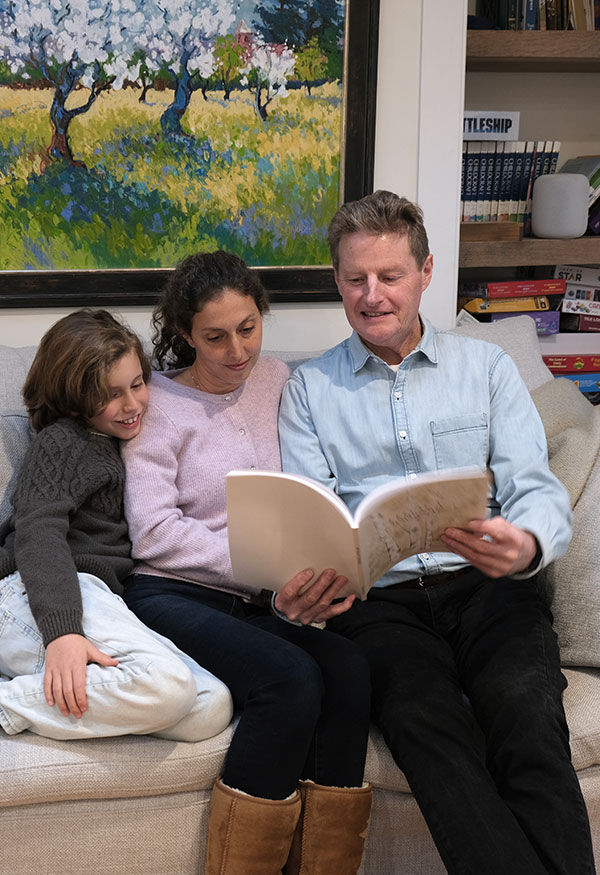 man sharing life stories with daughter and grandson